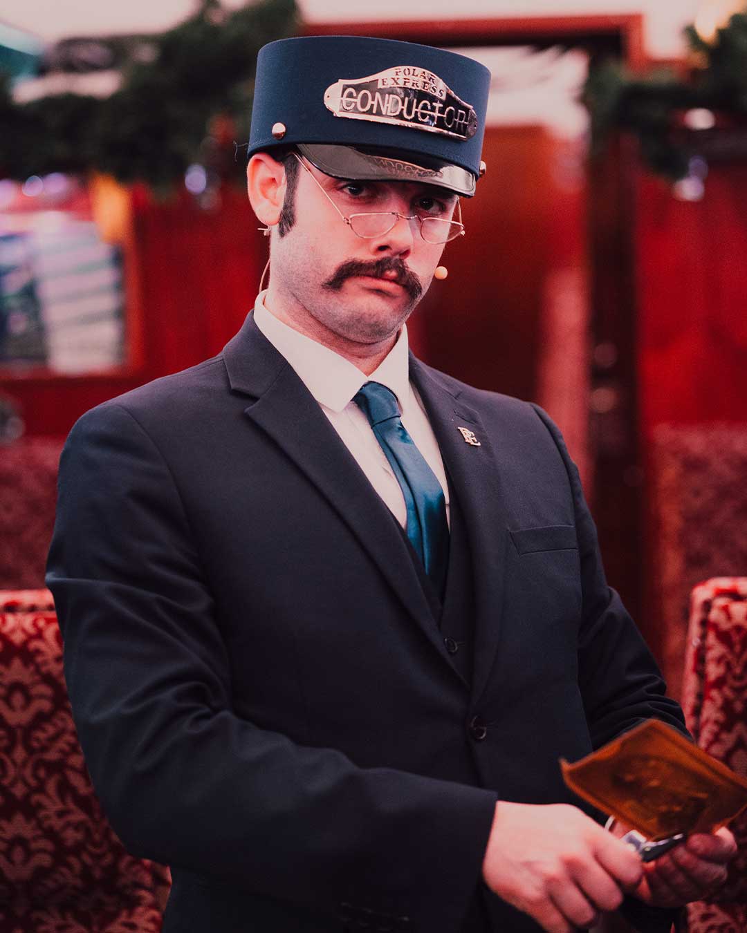 conductor on board The Polar Express Ticket