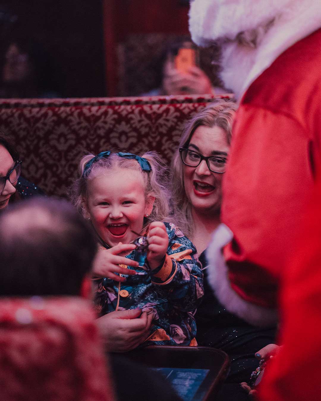 family on board the polar express train ride